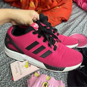 Pink and black adidas shoes